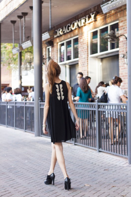Mizusawa strutting to Dragonfly, wearing Rachel Roy's black pleated dress with cream bows. Photo courtesy of Ronan Galvez.